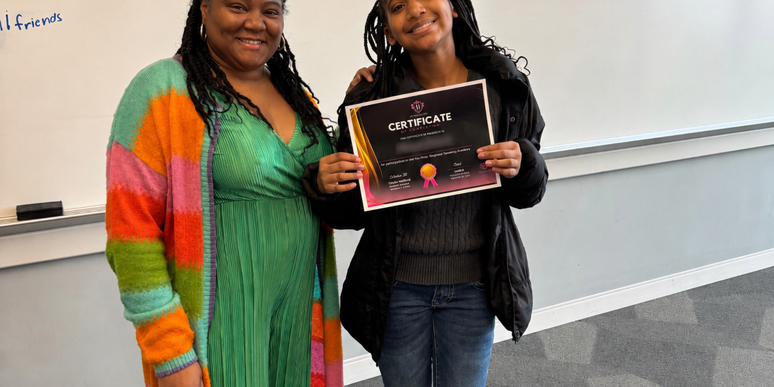Jr. Beauty-Preneur Academy participant holding a certificate beside her mentor
